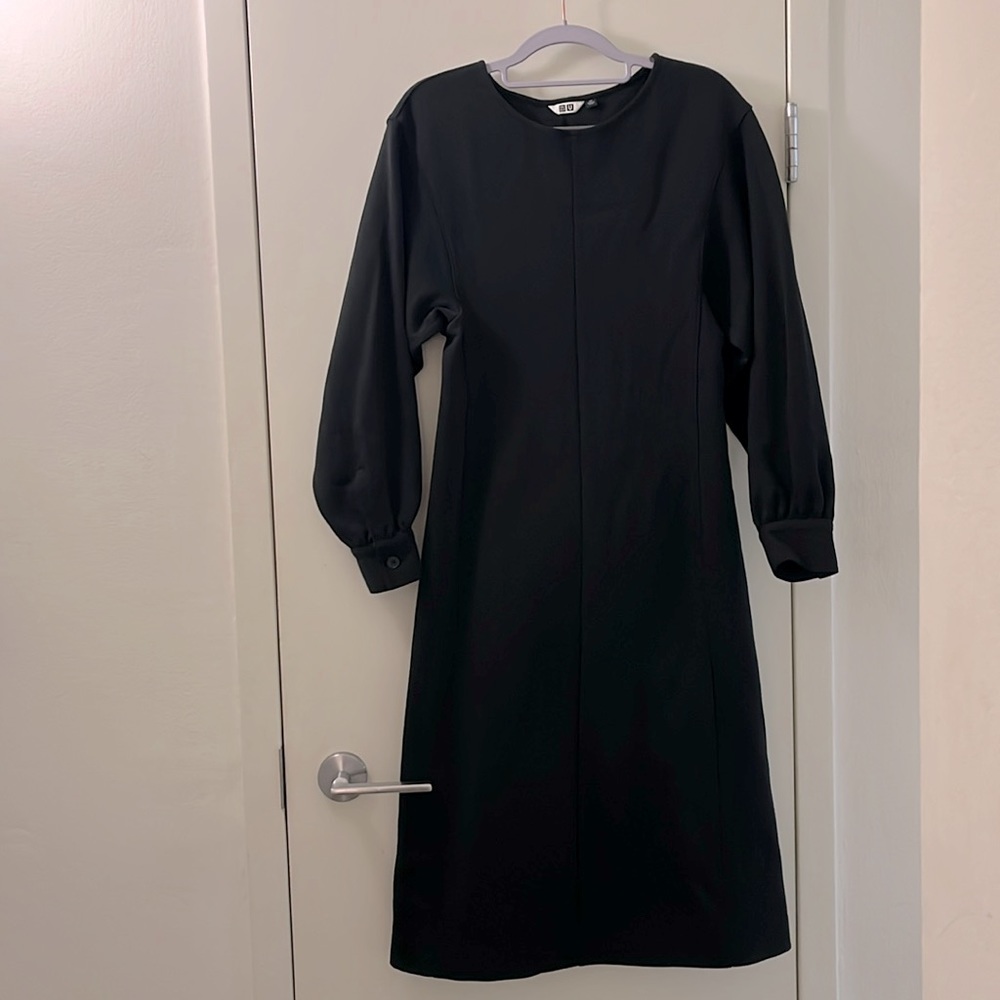 Modern black dress. Fitted, slightly puffed sleeve. SizeXS. Excellent condition